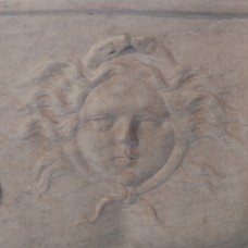 Roman face in sun (Sol) on the bust of emperor Domitian